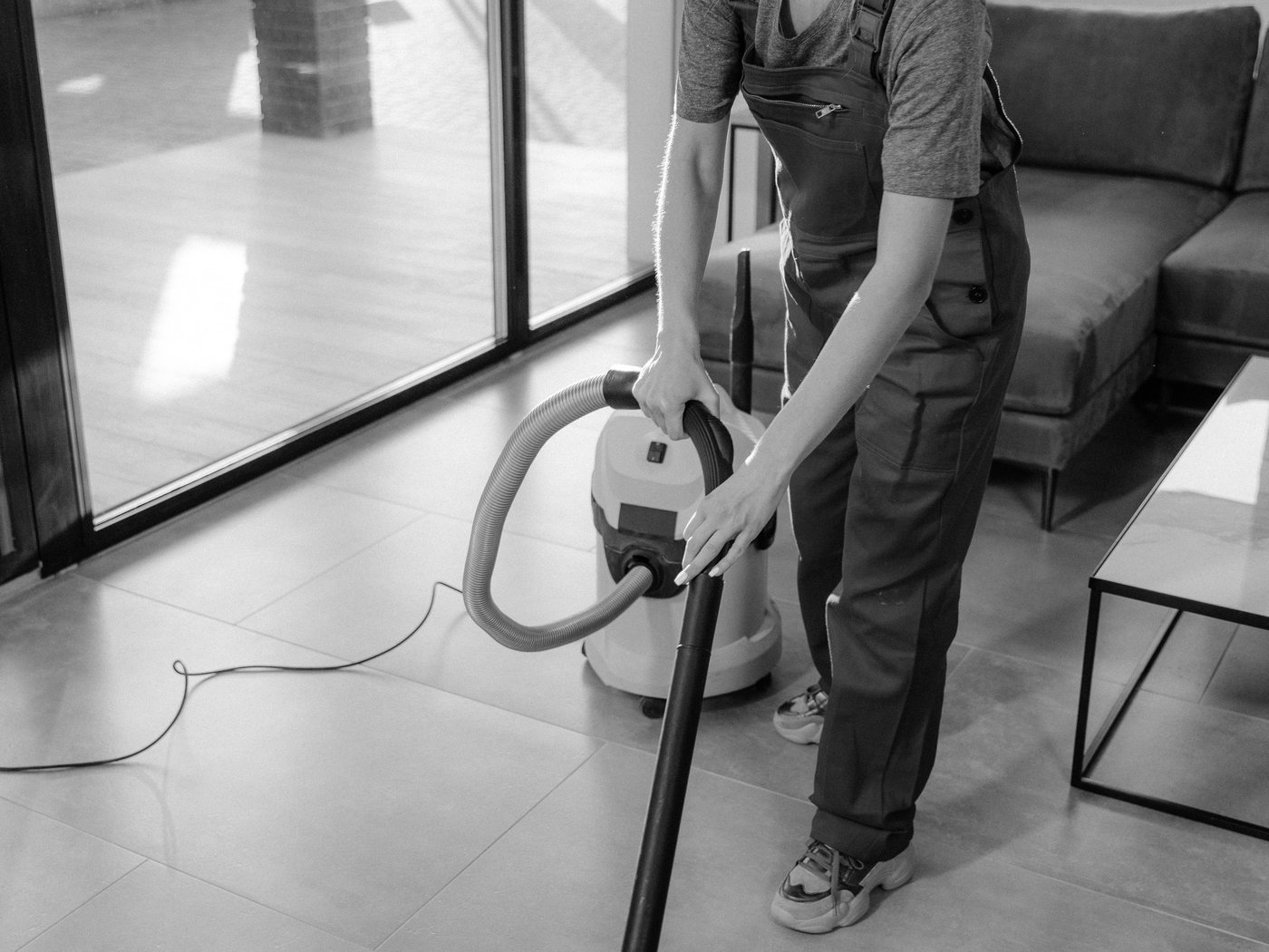 Sterling Clean team member cleaning a kitchen surface