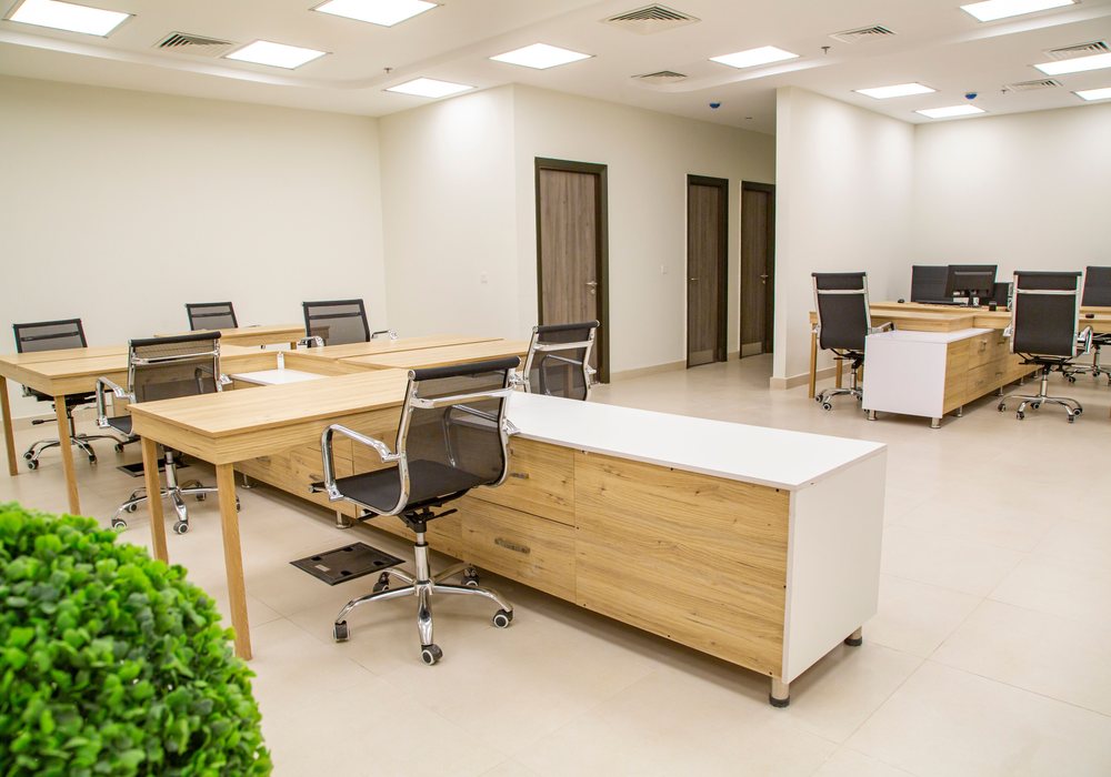 Clean modern office with desks and chairs